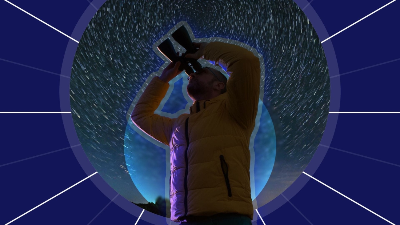a-man-on-a-starry-night-using-binoculars.jpg
