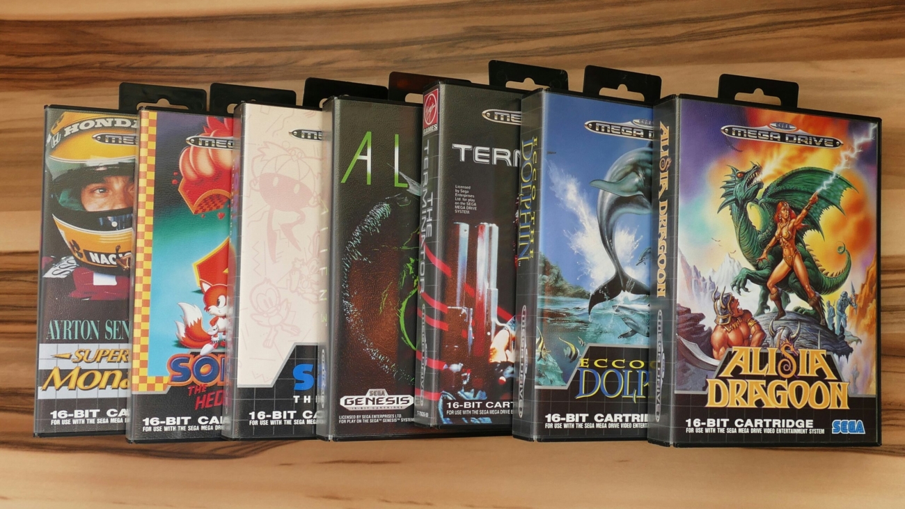 a row of nintendo games sitting on top of a wooden shelf